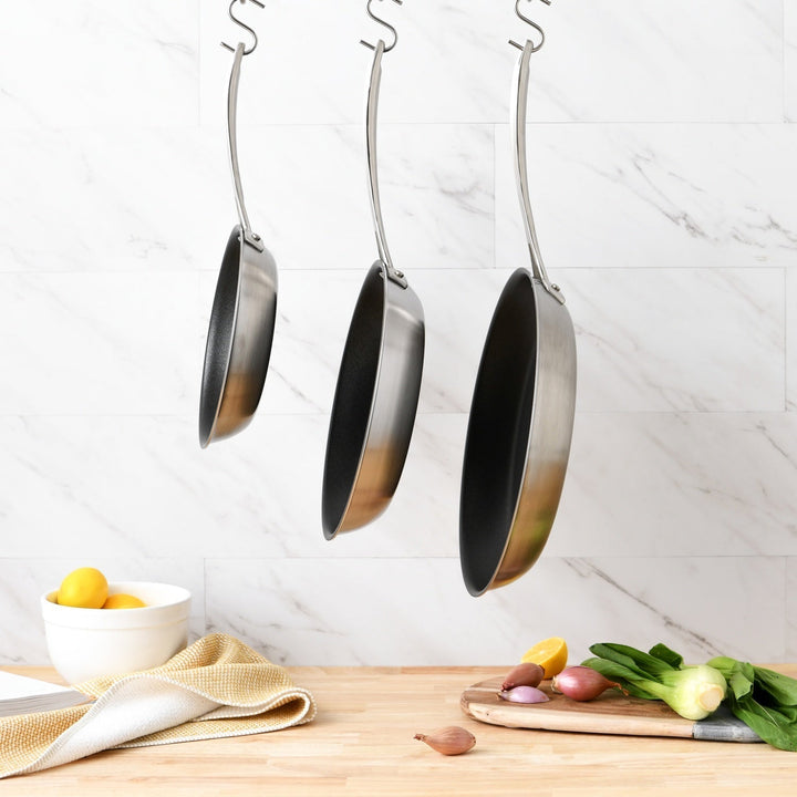 8, 10, and 12 inch Nonstick Skillets hanging from a hook #option_8-inch
